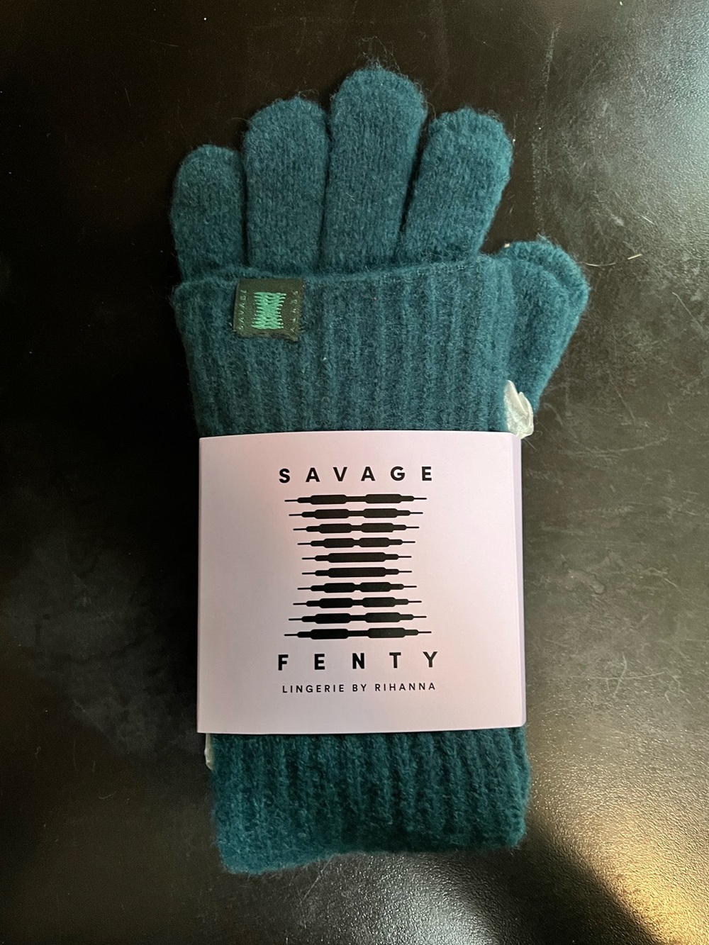 Savage Fenty Fuzz Fit dark teal gloves.